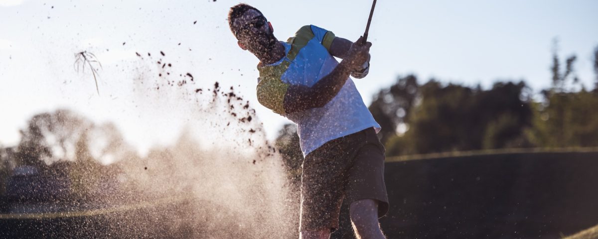 Guy playing golf