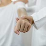 patients with shoulder injuries massaging their shoulders for muscle recovery in the rehabilitation