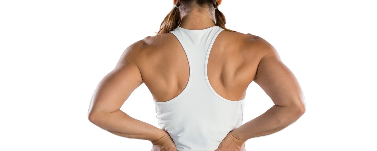 Rear view of female athlete suffering from back pain