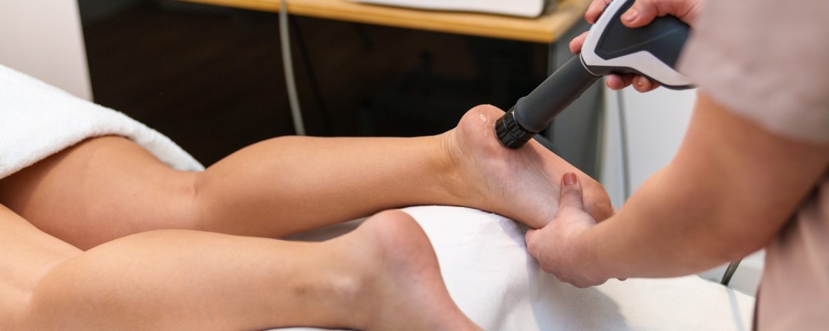 Therapeutic Shockwave Treatment Applied to Patient's Ankle